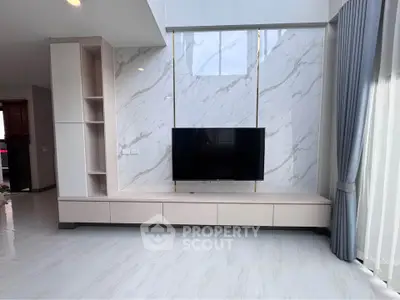 Modern living room with sleek TV unit and marble accent wall