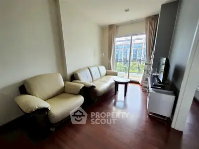 Spacious living room with modern furniture and large window view