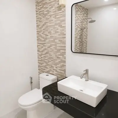 Modern bathroom with sleek fixtures and stylish tile design