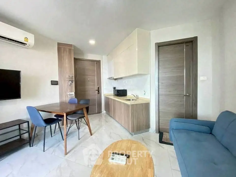 Modern living room with open kitchen and stylish furniture