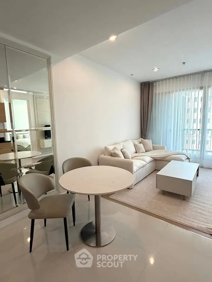 Modern living room with cozy sofa and dining area in bright apartment