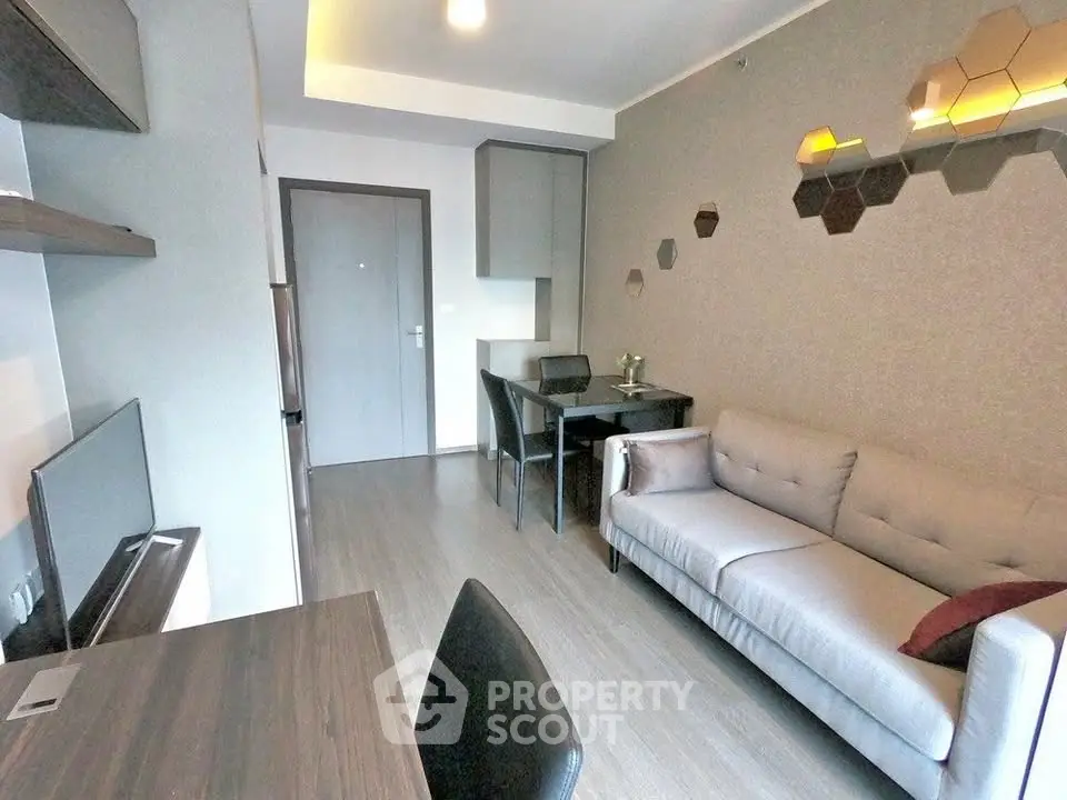 Modern living room with stylish decor and comfortable seating in a contemporary apartment.