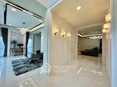 Luxurious modern living room with elegant lighting and plush furnishings, perfect for sophisticated living.