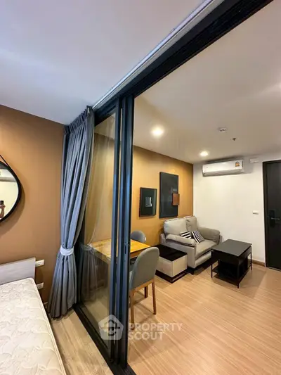 Modern living room with cozy seating and stylish decor in a contemporary apartment.