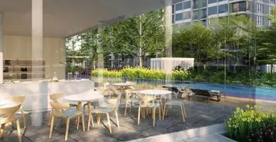 Luxurious poolside dining area with modern furniture and lush greenery
