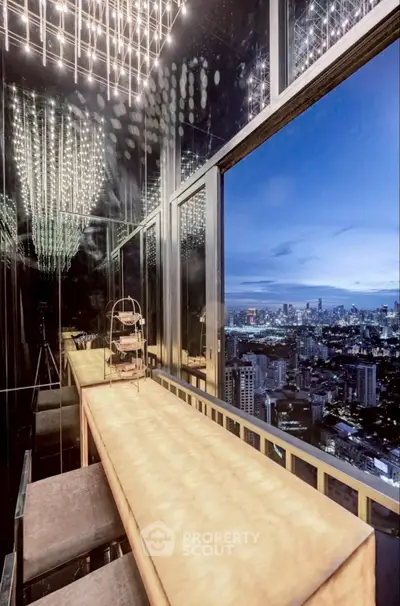 Stunning high-rise view from a luxurious balcony with cityscape panorama and elegant lighting.