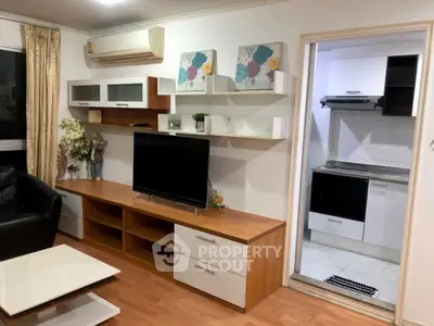 Cozy living room with modern decor and open kitchen layout