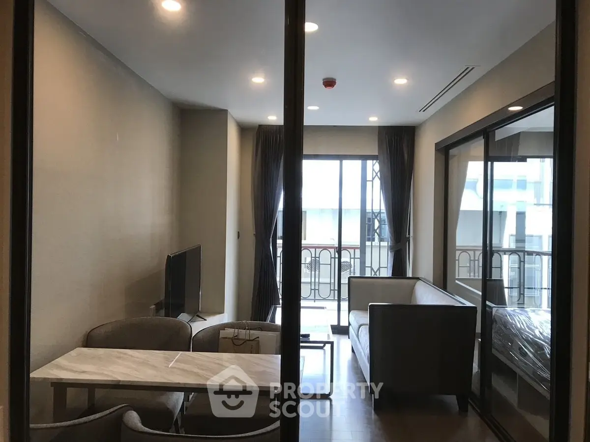 Modern living room with balcony view and stylish furniture