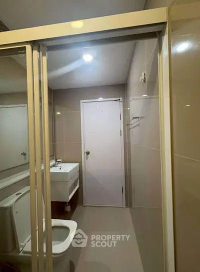 Modern bathroom with sleek fixtures and neutral tones