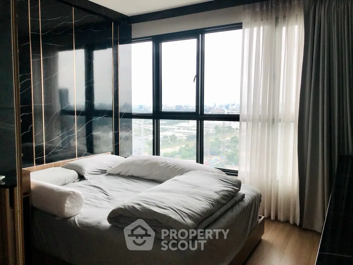 Luxurious bedroom with panoramic city view and elegant decor