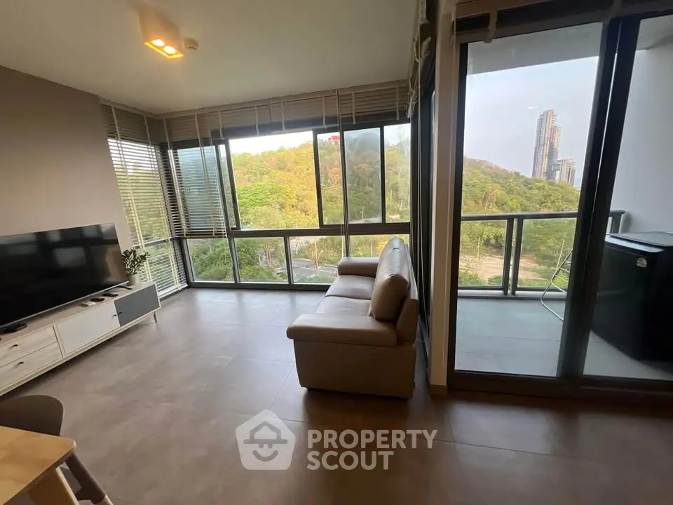 Spacious living room with stunning view and large balcony in modern apartment