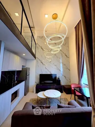 Luxurious modern living room with high ceilings and elegant lighting in a stylish apartment.