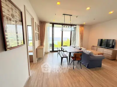 Spacious living room with ocean view and modern furnishings