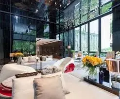 Luxurious modern living room with floor-to-ceiling windows and elegant decor