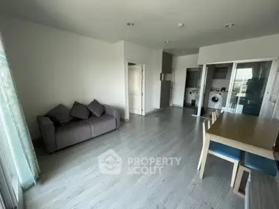 Spacious modern living room with open kitchen and stylish dining area
