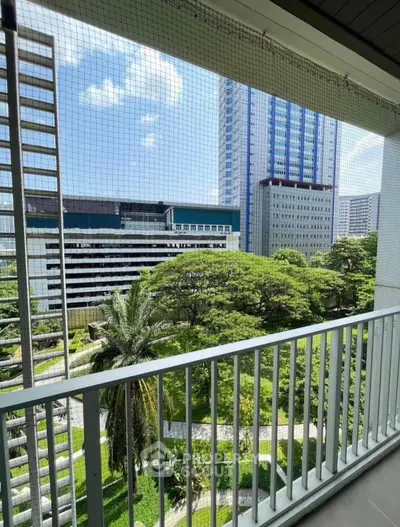 Stunning urban balcony view with lush greenery and modern high-rise buildings.