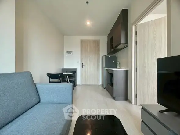 Modern living room with sleek kitchen in open layout apartment