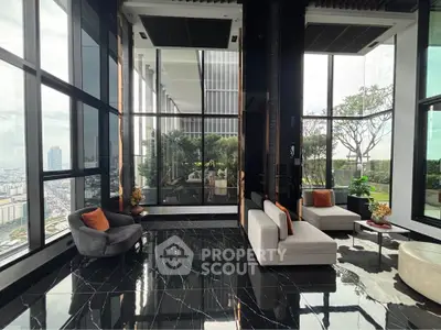 Luxurious high-rise living room with panoramic city views and modern decor