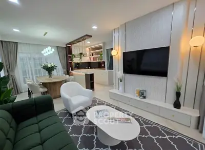 Luxurious open-plan living room with modern kitchen and elegant decor