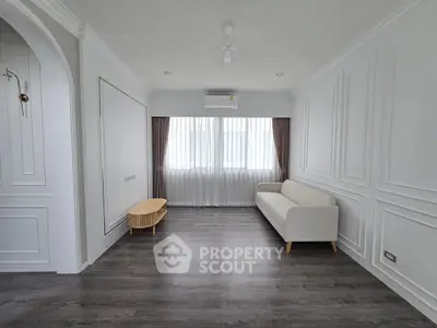 Elegant minimalist living room with white walls and modern furniture