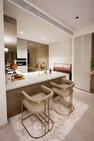 Luxurious modern kitchen with sleek design and elegant bar seating