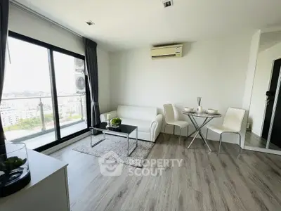 Modern living room with balcony view and stylish furniture