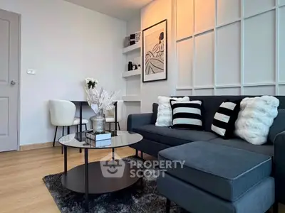 Stylish modern living room with chic decor and cozy seating area.