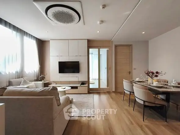 Modern living room with elegant dining area and stylish decor