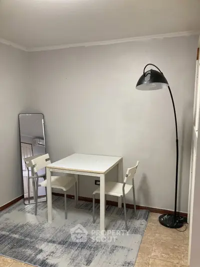 Cozy study area with modern furniture and stylish floor lamp