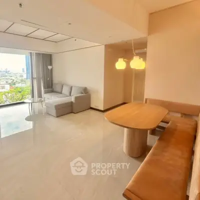 Spacious modern living room with city view and elegant furnishings
