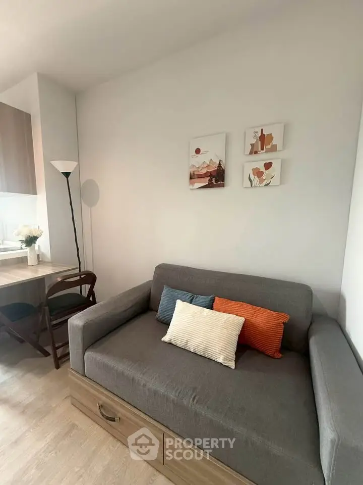 Cozy living room with modern sofa and stylish decor in a contemporary apartment.