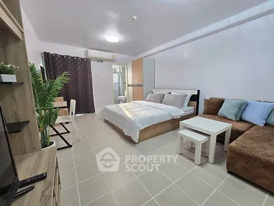 Spacious studio apartment with modern furnishings and cozy ambiance