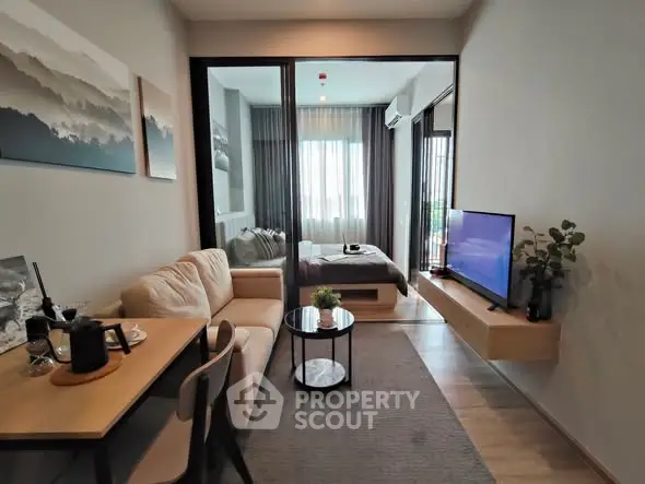 Modern studio apartment with cozy living area and bedroom separation