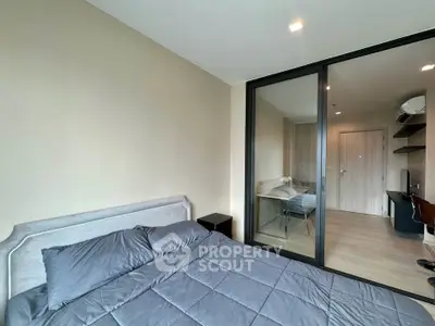 Modern bedroom with glass partition and stylish decor in urban apartment