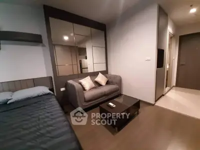 Modern studio apartment with cozy living area and stylish decor