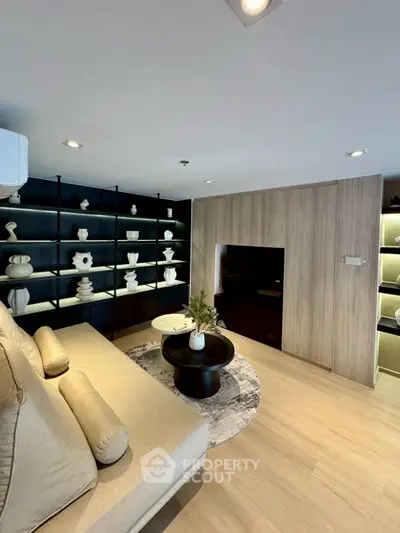 Modern living room with stylish decor and built-in shelving
