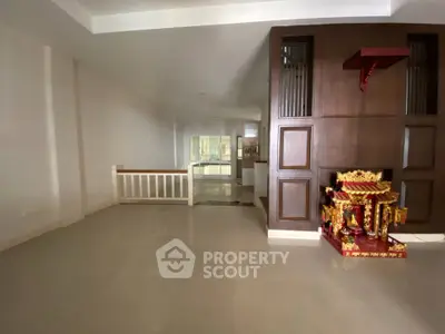 Spacious interior with elegant wooden accents and ample natural light, perfect for modern living.