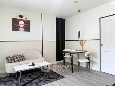 Modern living room with stylish decor and cozy seating area, perfect for relaxation and entertaining.