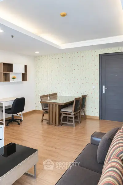 Modern living room with stylish furniture and wooden flooring in a contemporary apartment.