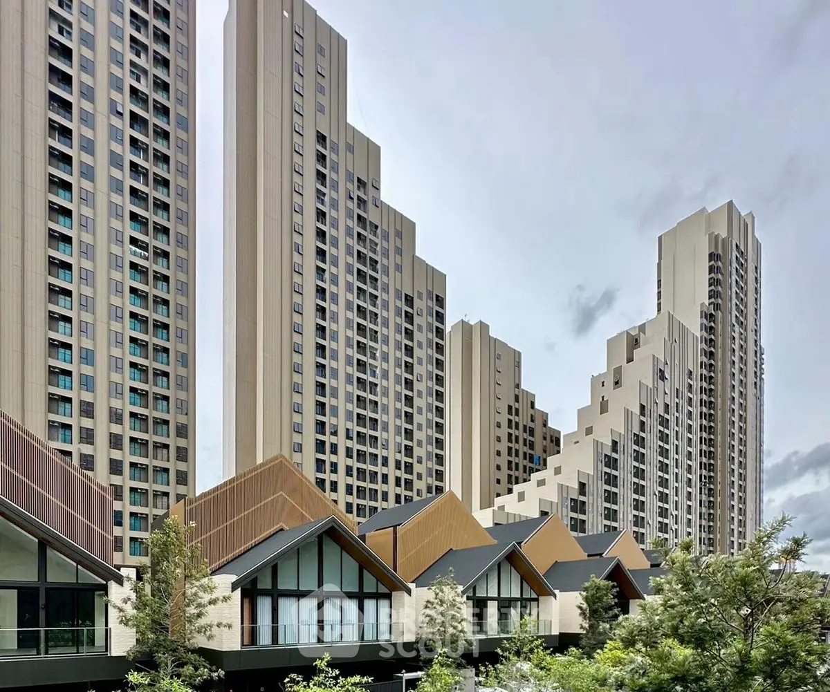 Modern high-rise residential buildings with unique architectural design and lush greenery.