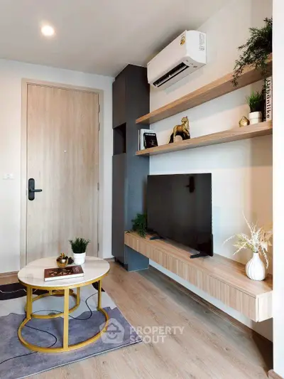 Modern living room with stylish decor and wall-mounted TV