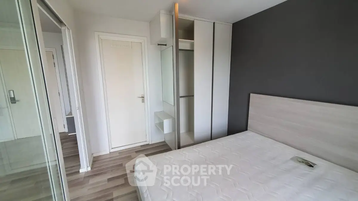 Modern bedroom with sleek design and ample storage space