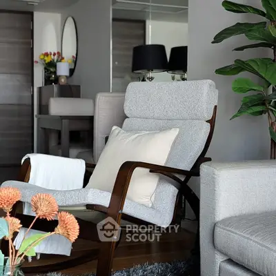 Stylish modern living room with elegant furniture and vibrant decor accents.