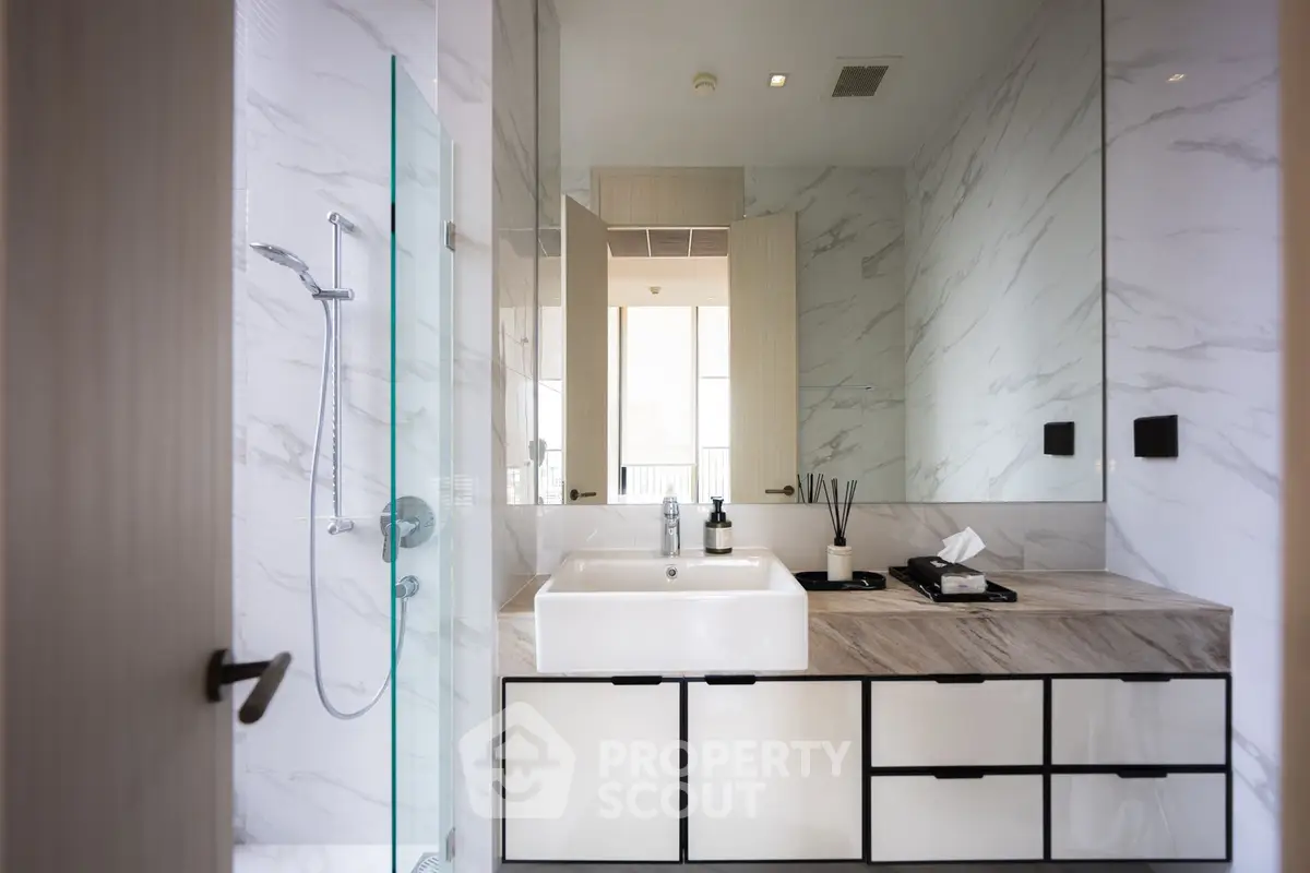 Modern bathroom with sleek design and marble accents