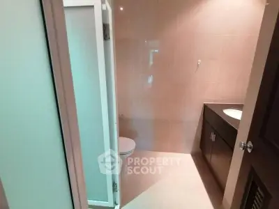 Modern bathroom with sleek design and ample lighting