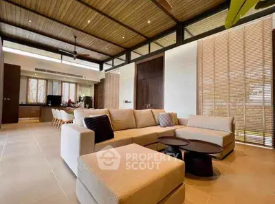 Spacious modern living room with elegant decor and large windows