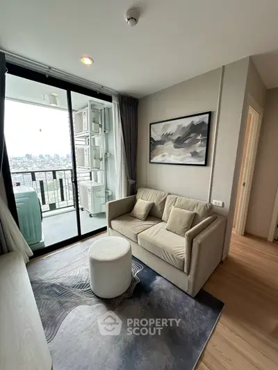 Modern living room with balcony view in high-rise apartment