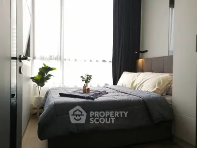 Cozy modern bedroom with natural light and stylish decor