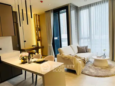 Modern living room with elegant decor and large windows in a luxury apartment.