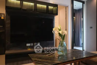 Modern living room with sleek TV setup and elegant marble table